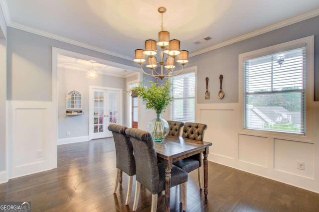 dining room featuring ornamental molding and dark hardwood / wood-style floors