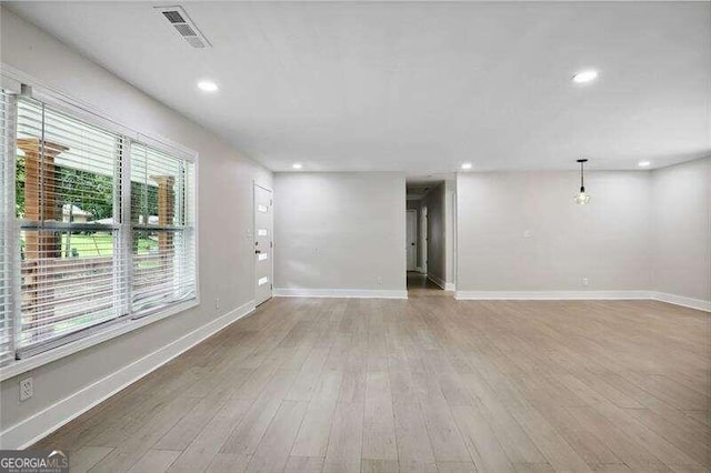 empty room featuring wood-type flooring