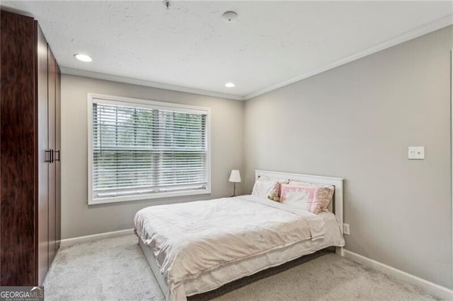 carpeted bedroom featuring crown molding