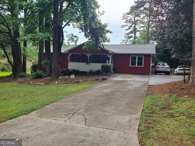 ranch-style house with a front yard