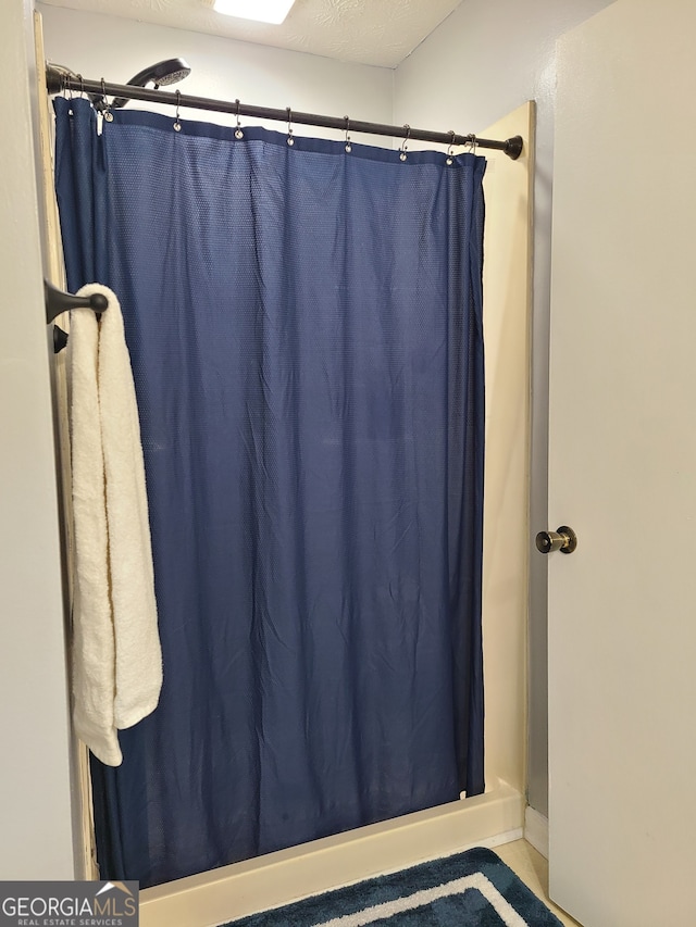 bathroom with a shower with curtain