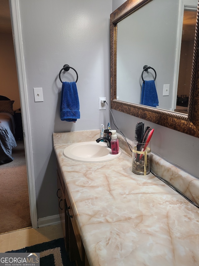 bathroom with vanity and tile patterned flooring