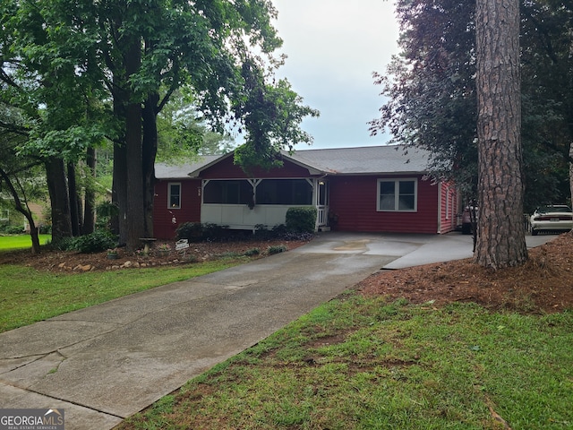 ranch-style house with a front lawn