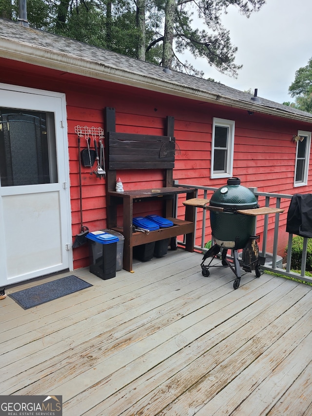 wooden terrace with grilling area