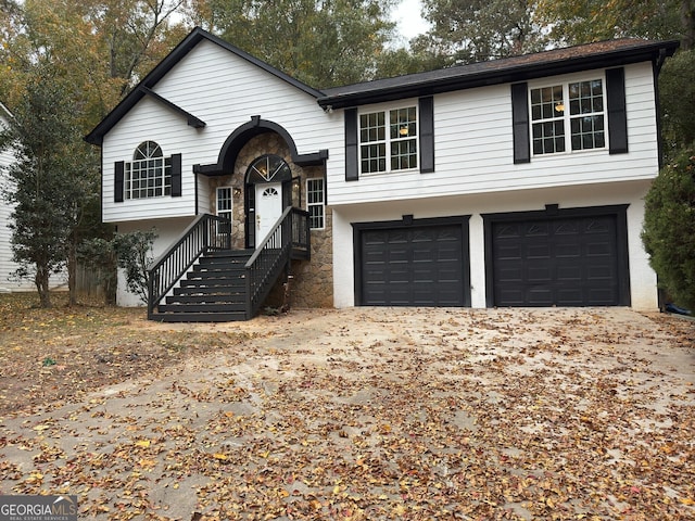 raised ranch featuring a garage