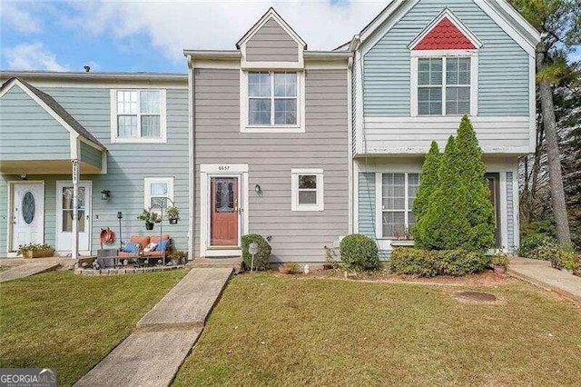 view of property with a front lawn