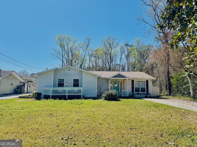 ranch-style home with a front lawn