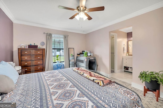 bedroom with ceiling fan, connected bathroom, baseboards, and ornamental molding