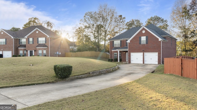 view of front of home featuring a front yard and a garage