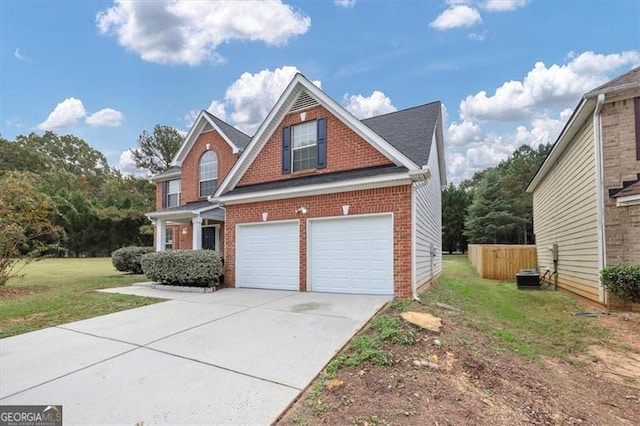 view of front of house featuring a garage, central AC, and a front yard