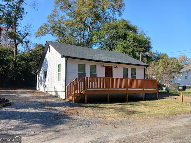 view of front of property with a wooden deck