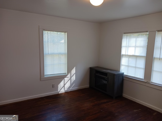 empty room with dark wood-type flooring