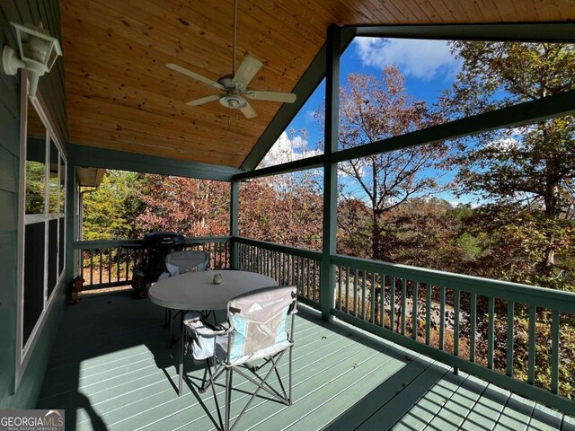 wooden deck with ceiling fan