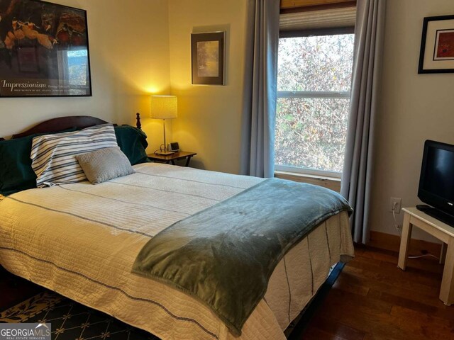 bedroom featuring dark hardwood / wood-style floors