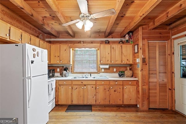 kitchen with wooden ceiling, white appliances, beamed ceiling, and light hardwood / wood-style flooring