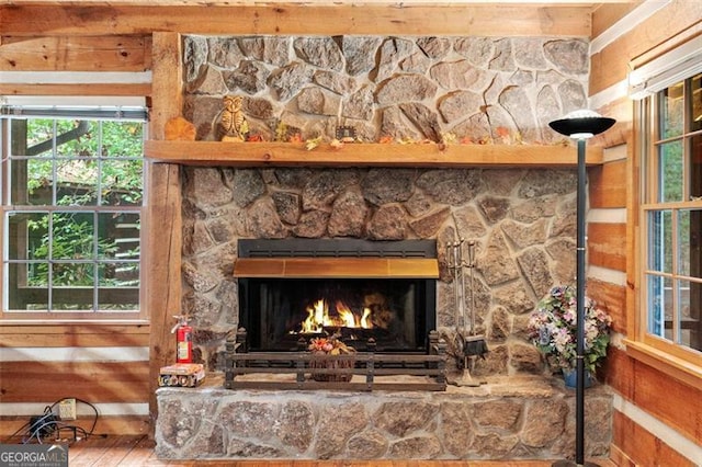 details featuring a fireplace and hardwood / wood-style flooring