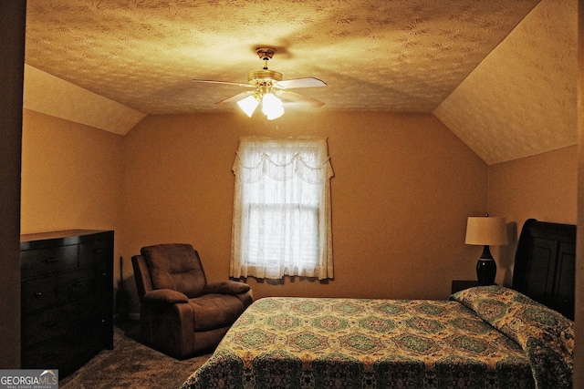 carpeted bedroom featuring a textured ceiling, ceiling fan, and vaulted ceiling