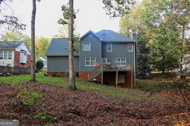 back of house with cooling unit and a wooden deck