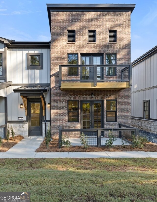 view of community featuring an outdoor fire pit and a yard