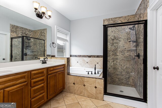 bathroom featuring vanity, independent shower and bath, and tile patterned floors