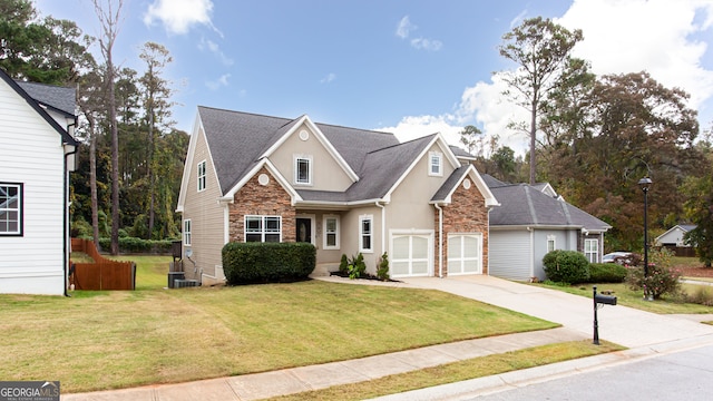 front facade featuring a garage and a front lawn