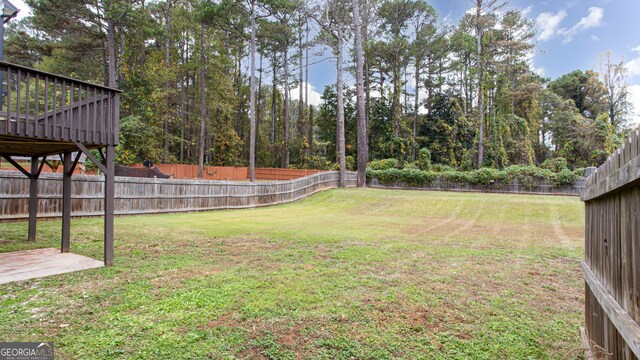 view of yard featuring a deck