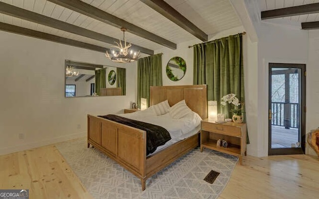 bedroom featuring an inviting chandelier, beam ceiling, and light wood-type flooring