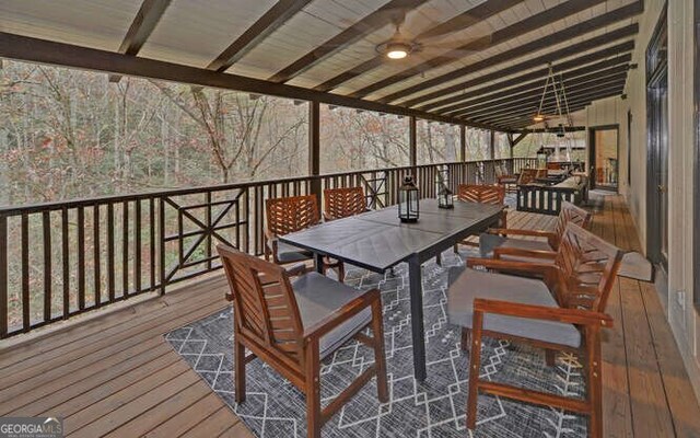 7670 Hiawassee Wilderness Trl, Hiawassee, GA 30546 - wooden deck featuring outdoor dining space and ceiling fan