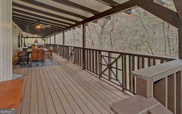 wooden terrace featuring ceiling fan