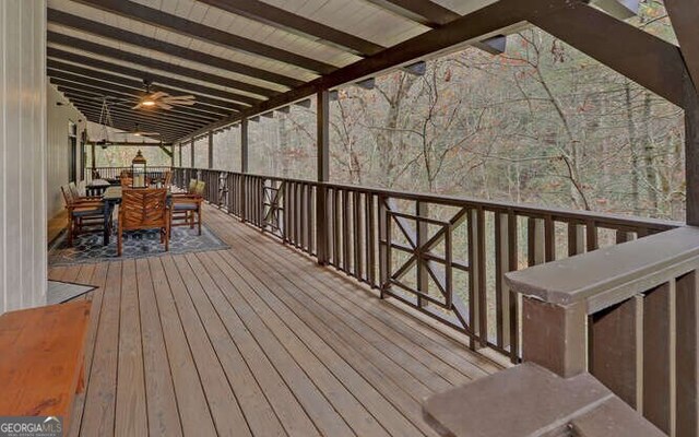 7670 Hiawassee Wilderness Trl, Hiawassee, GA 30546 - wooden terrace with outdoor dining space