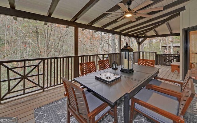 wooden terrace featuring ceiling fan