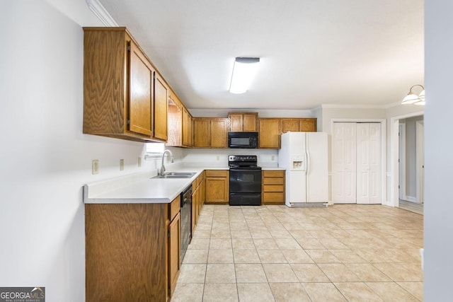 kitchen featuring light tile patterned floors, sink, ornamental molding, and black appliances