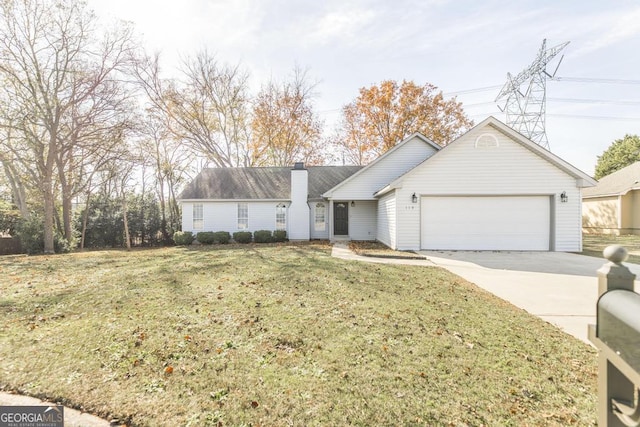 ranch-style home featuring a garage and a front lawn