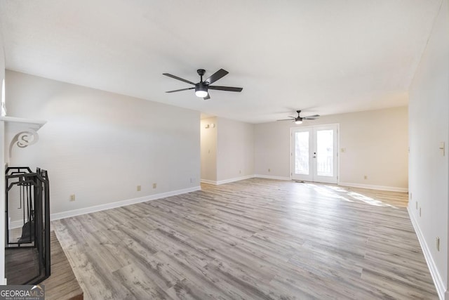 unfurnished living room featuring ceiling fan, light hardwood / wood-style floors, and french doors