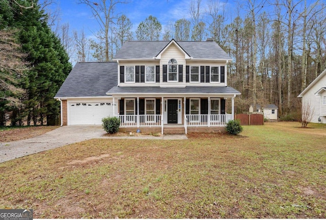 view of front facade with a porch, a garage, and a front lawn