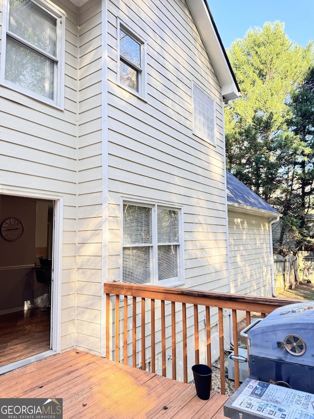 wooden terrace featuring area for grilling