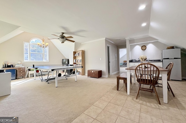 playroom featuring light carpet, ceiling fan with notable chandelier, vaulted ceiling, and ornamental molding