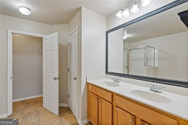 bathroom with an enclosed shower and vanity