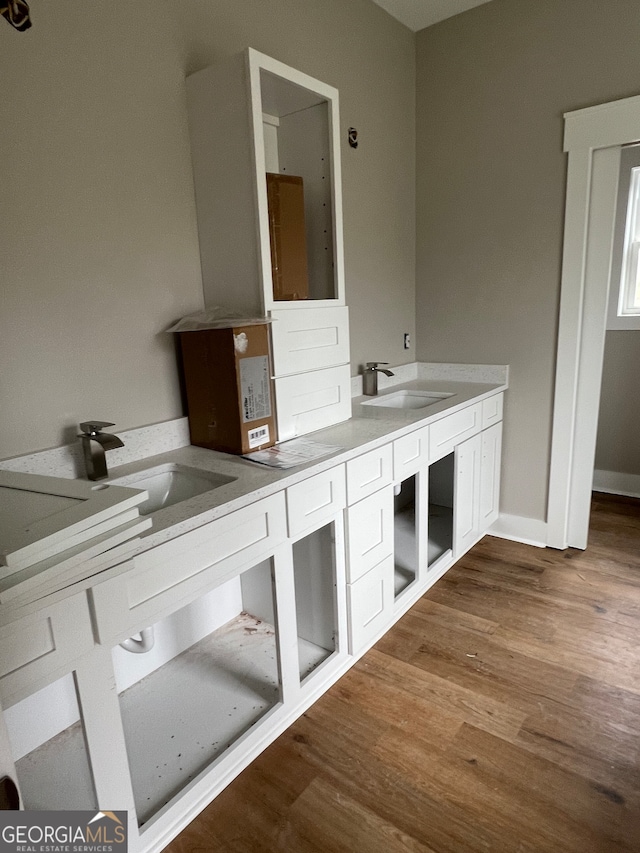 bathroom featuring hardwood / wood-style floors and vanity