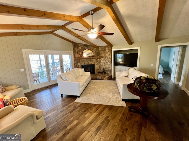 living room with a fireplace, lofted ceiling with beams, hardwood / wood-style flooring, and ceiling fan