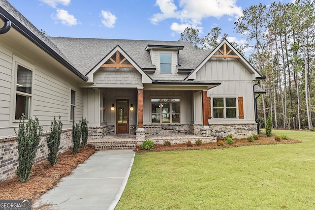 craftsman-style house with a porch and a front lawn