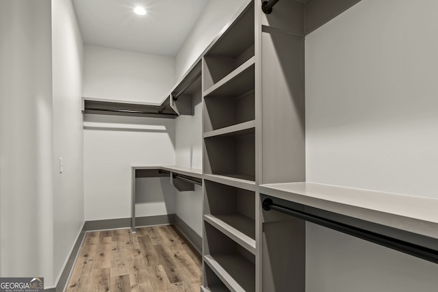 spacious closet featuring light wood-type flooring