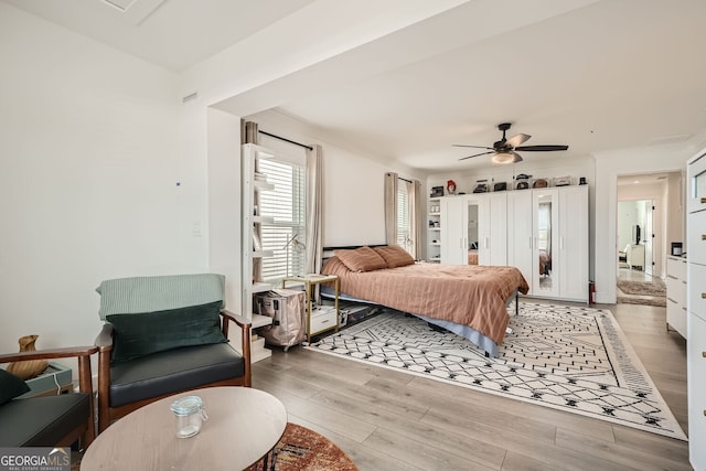 bedroom featuring ceiling fan and light wood-type flooring