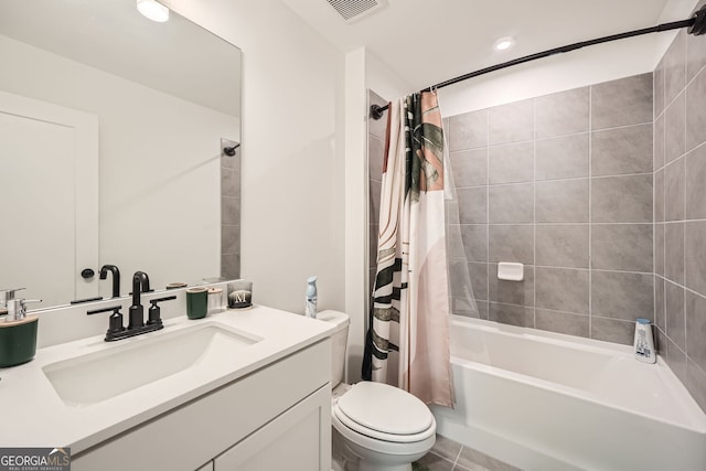 full bathroom featuring vanity, shower / tub combo with curtain, and toilet