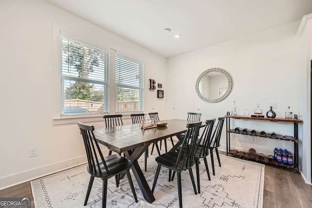 dining room with hardwood / wood-style flooring