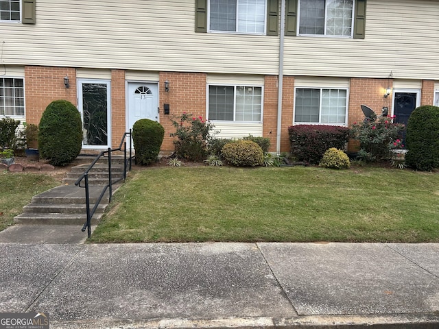 entrance to property with a yard