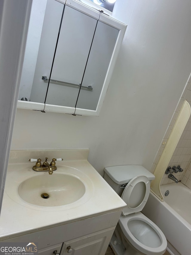 full bathroom featuring vanity, toilet, and shower / bathtub combination