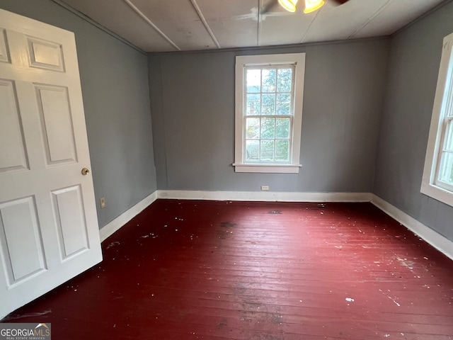 unfurnished room featuring dark hardwood / wood-style flooring