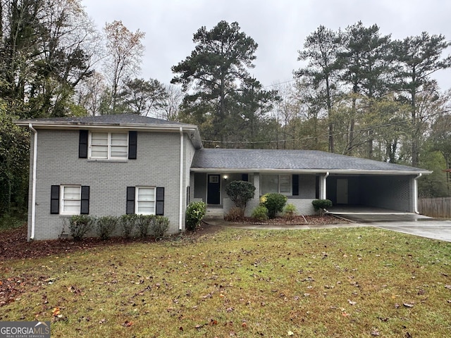 2929 Stratford Mill Rd, Lithonia, GA 30038 - tri-level home featuring a front lawn, brick siding, concrete driveway, and an attached carport