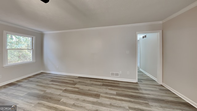 245 Southmoor Cir, Stockbridge, GA 30281 - unfurnished room with wood finished floors, ornamental molding, and baseboards